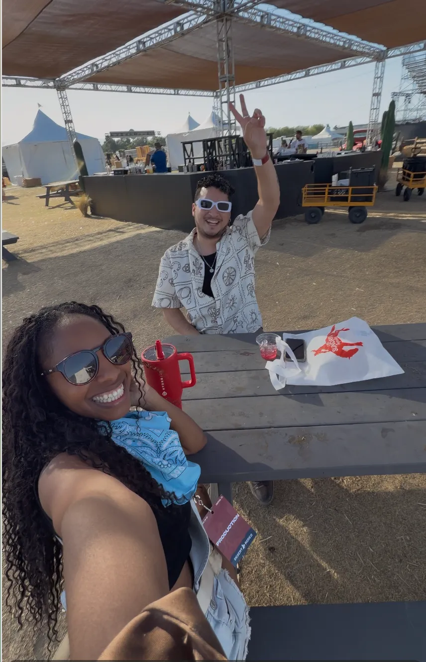Jessika and her friend George smiling together at Desert Rodeo
