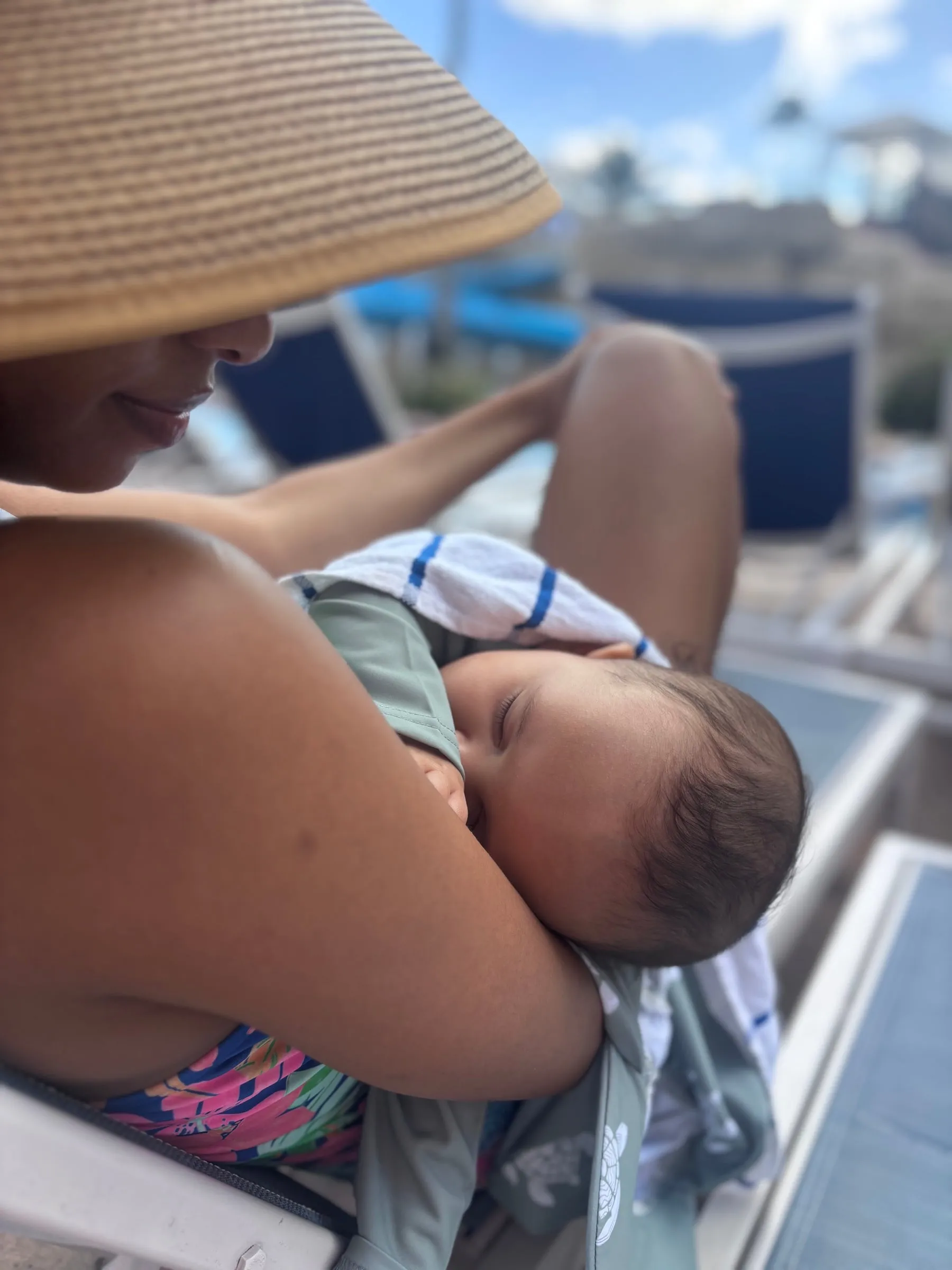 Noah sleeping in Jessika's arms by the pool