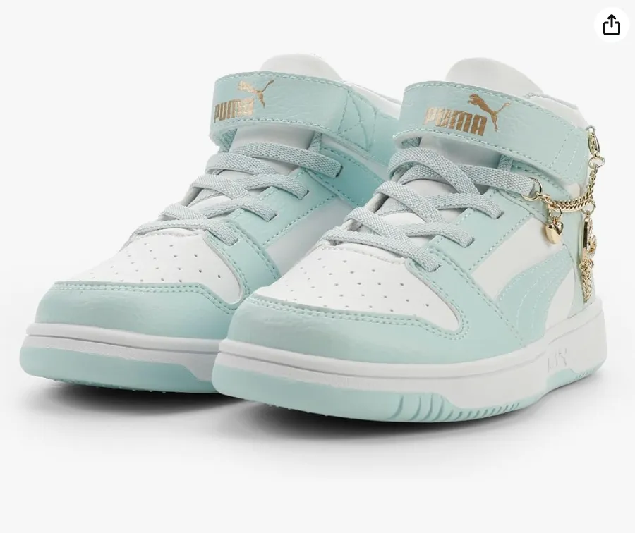 Mint and white Puma sneakers with gold accents and charm chain