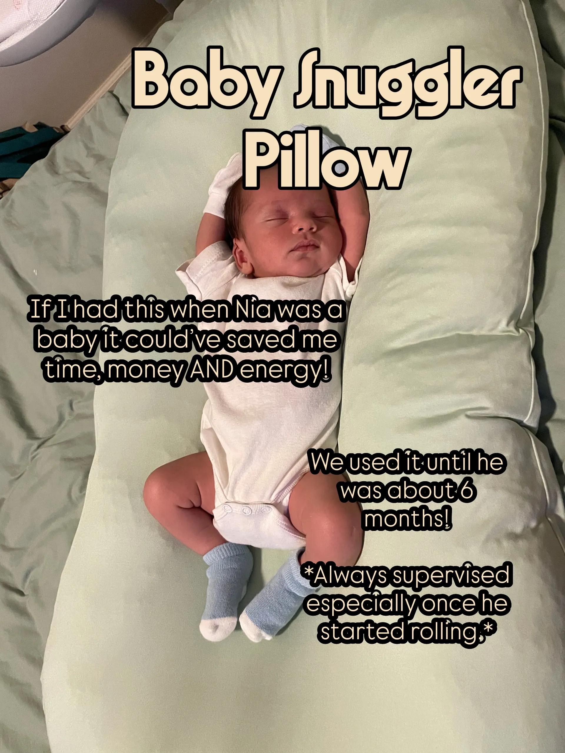 Noah pictured on a baby snuggler pillow