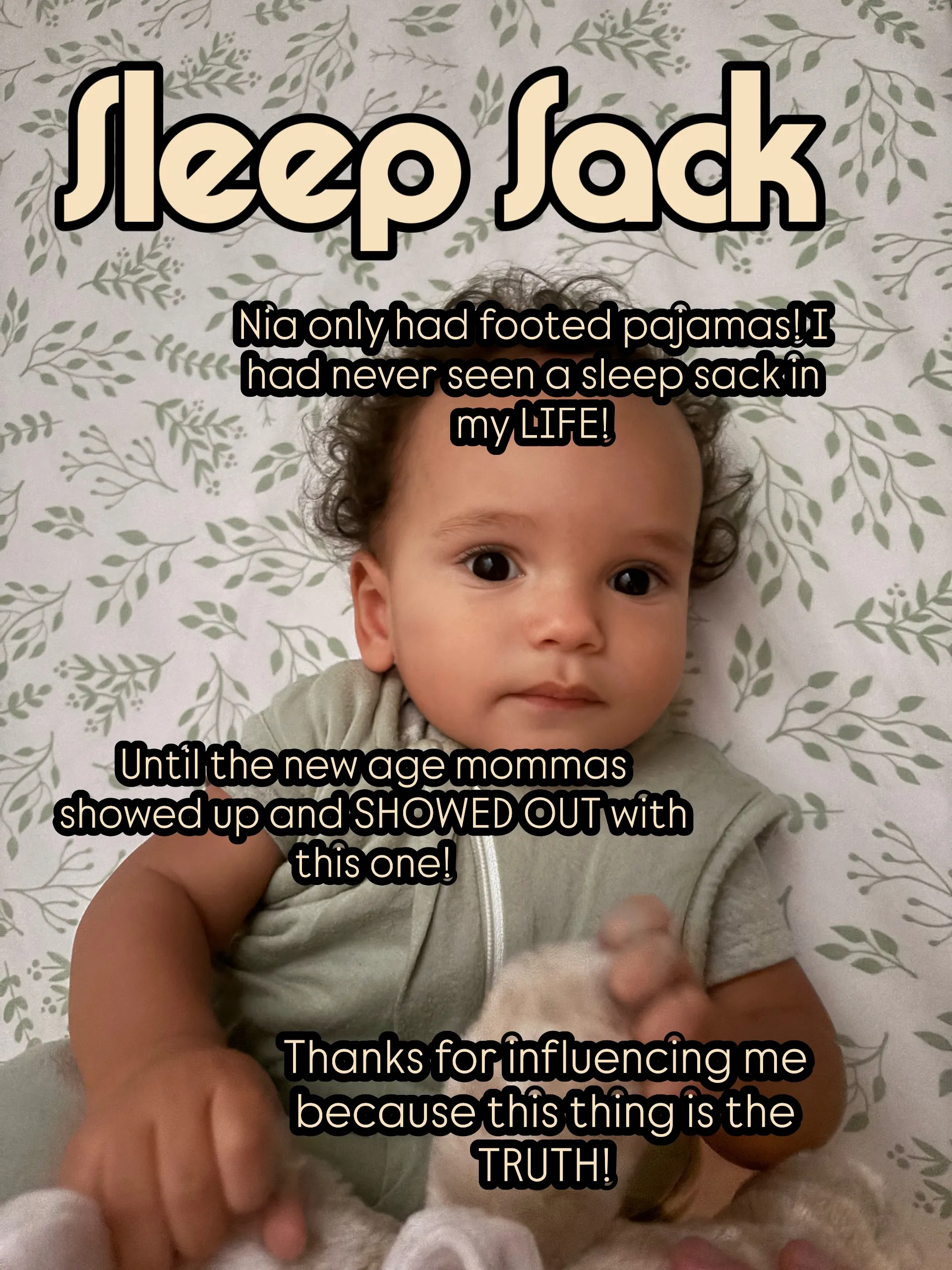 Noah wearing a sage sleep sack